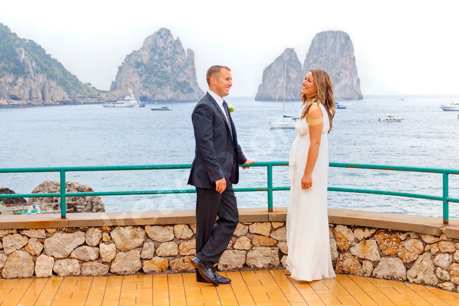 capri-009-0611 Bride and groom about to get married in Capri Italy in front of the Faraglioni at Canzone del Mare. Wedding Photographer Capri.