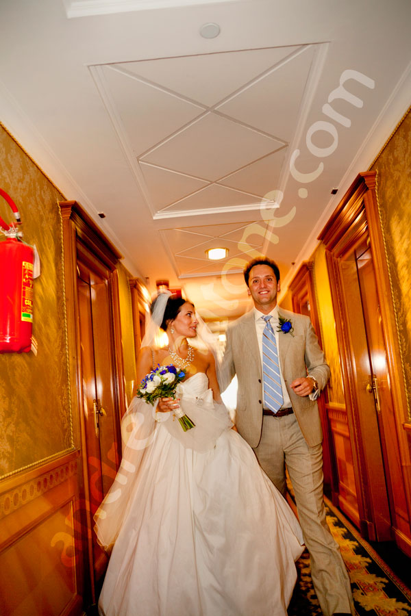 wedding-rome-005 Newlyweds walking together in a hotel corridor heading to get married