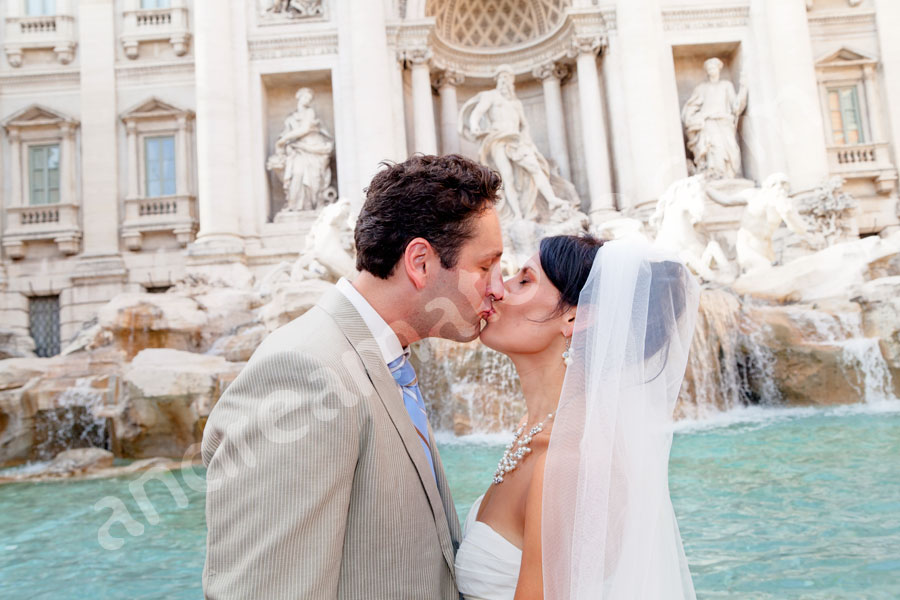 wedding-rome-3911-046 Man and woman just married kissing at Fontana di Trevi