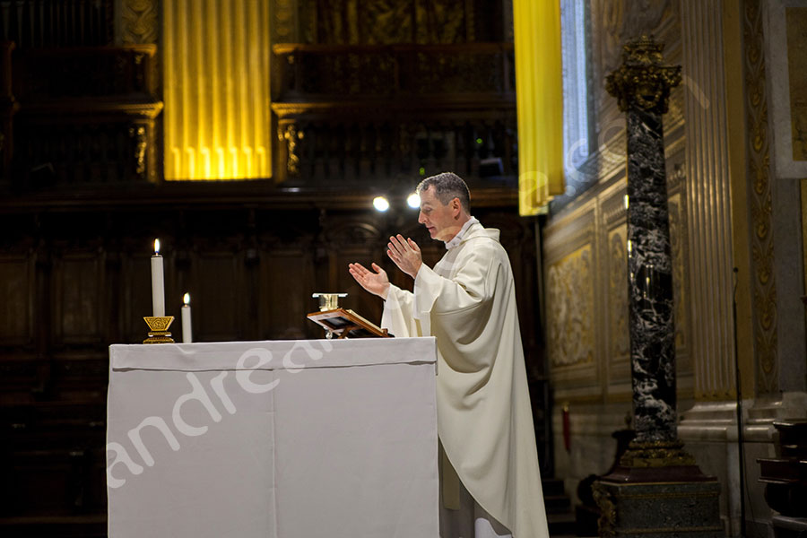 Priest celebrating mass on the altar 