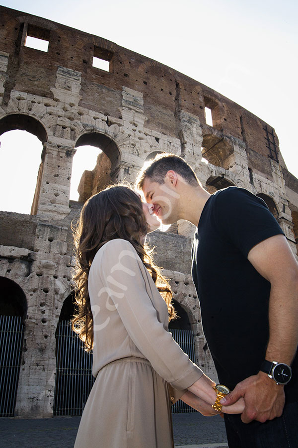 photographer-rome-2912-005 A romantic love story. Close up picture of a couple kissing in front of the Coliseum
