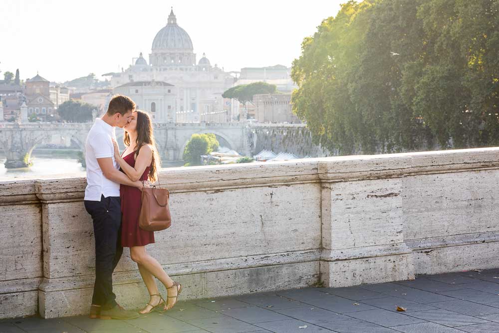 In love photographed from Ponte Umberto I at sunset engagement photoshoot