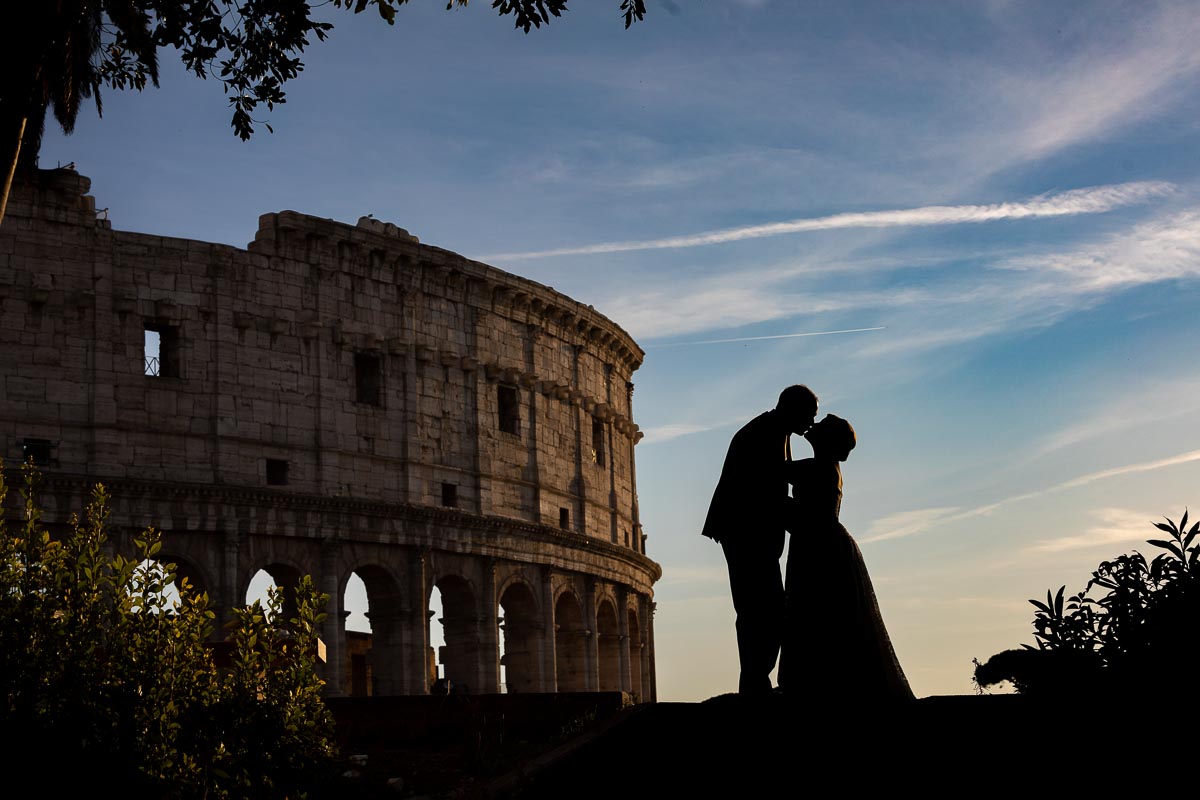 Elopement Wedding PhotoShoot in Rome Italy. Silhouette image taken at the roman coliseum. 