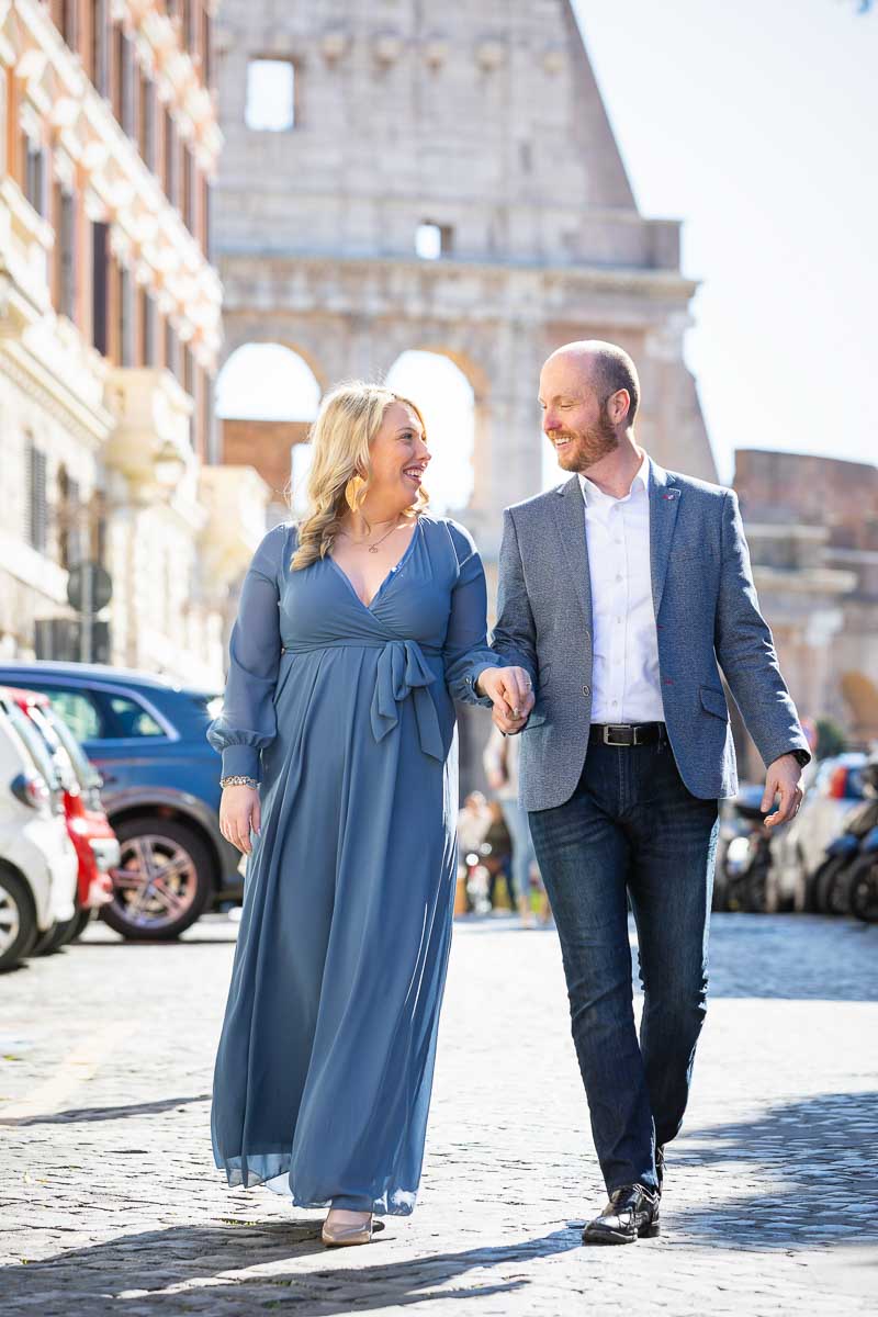 Walking together in Rome's cobblestone alleyway streets that have the Colosseum as a fantastic and unique backdrop