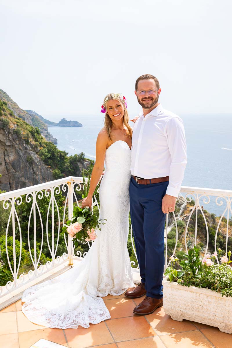 Newlywed portrait on a terrace over the coast in the town of Praiano Wedding Photography