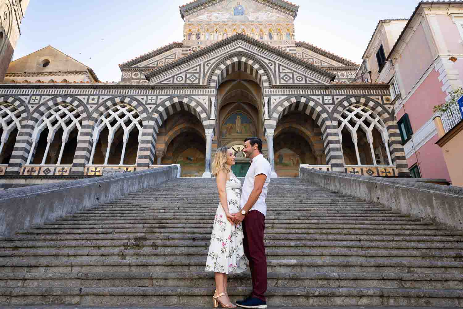 Duomo photoshoot posed on the staircase leading up Cathedral