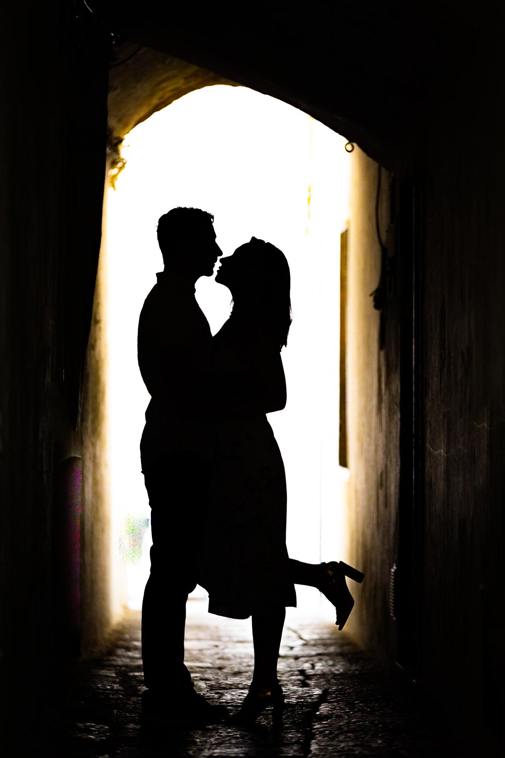 Silhouette image captured by a photographer in the alleyways if the Italian town