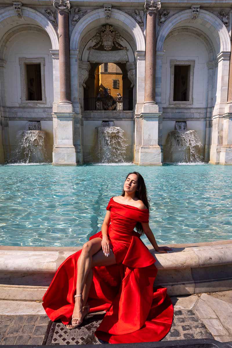 Sitting down pose next to a water fountain found in Gianicolo Italy