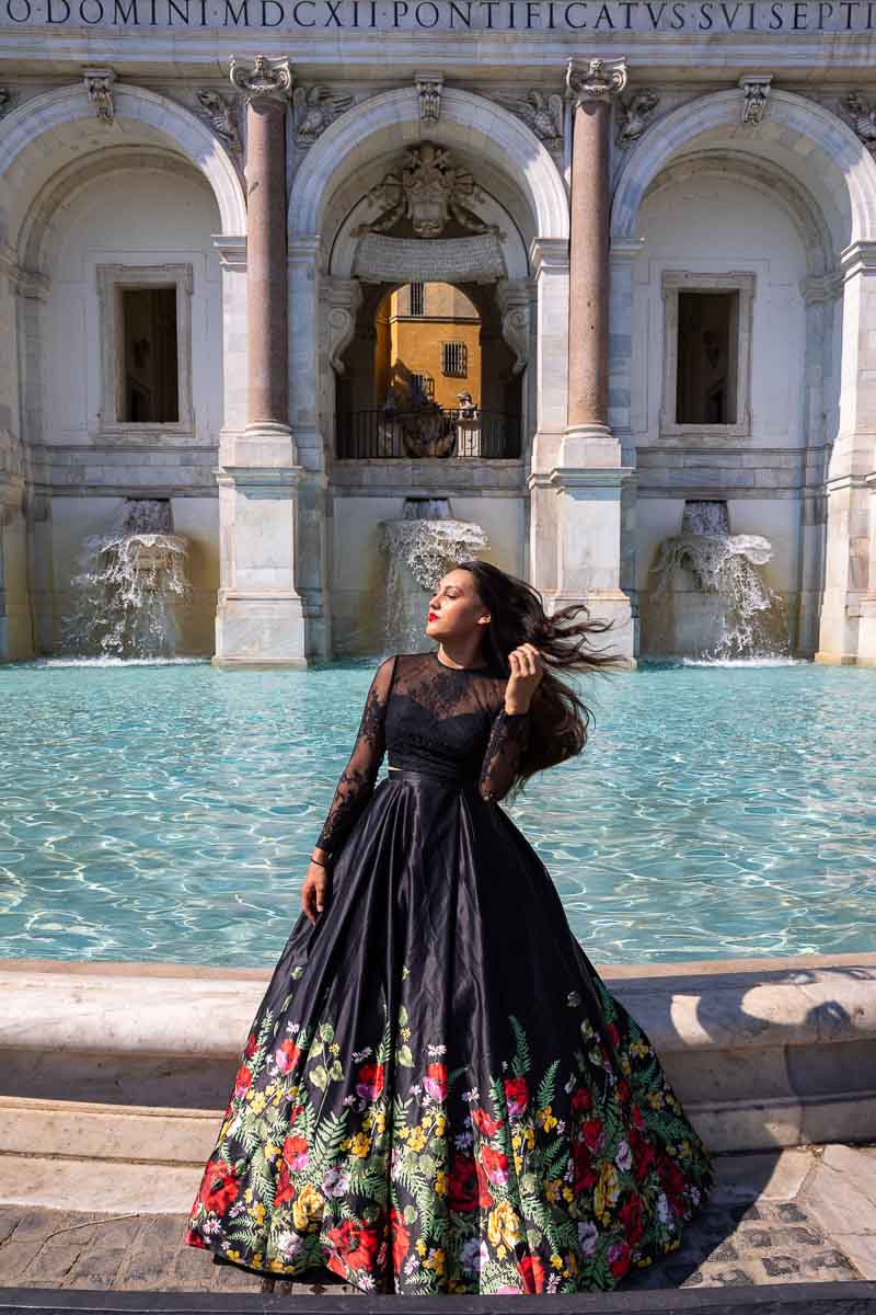 Model Photo Shoot by the Janiculum hill fontanone water fountain and looking sideway. Fashion photo shoot in Rome Italy