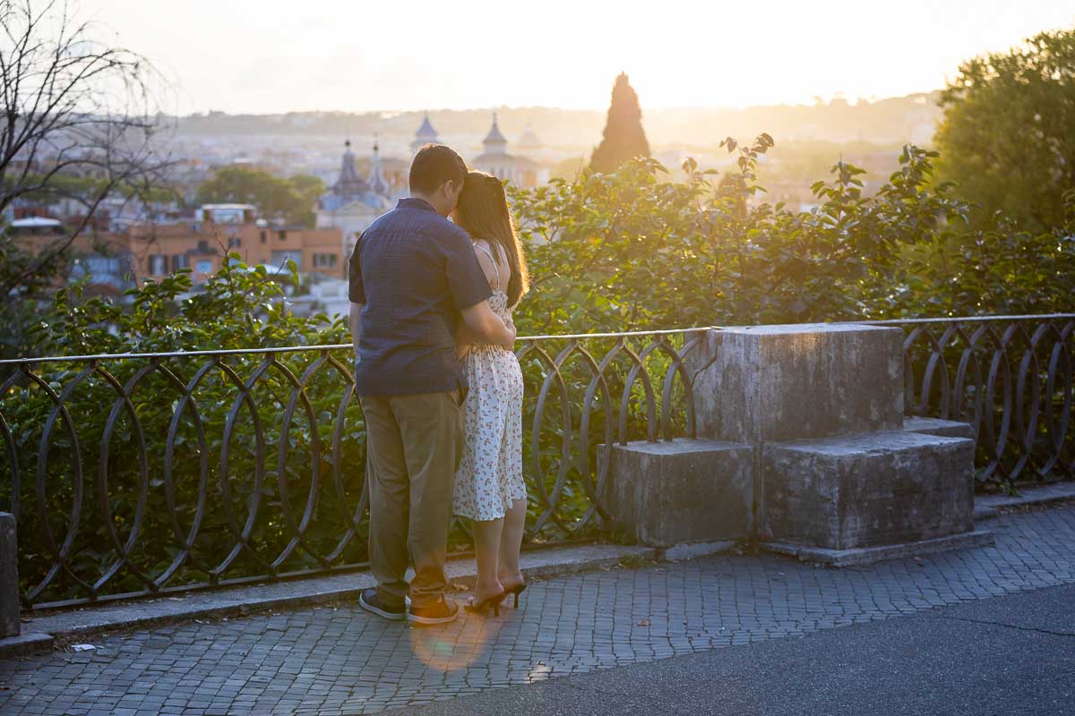 Discreetly proposing at the Pincio park outlook during a scenic sunset over the city. Rome Sunset Proposal