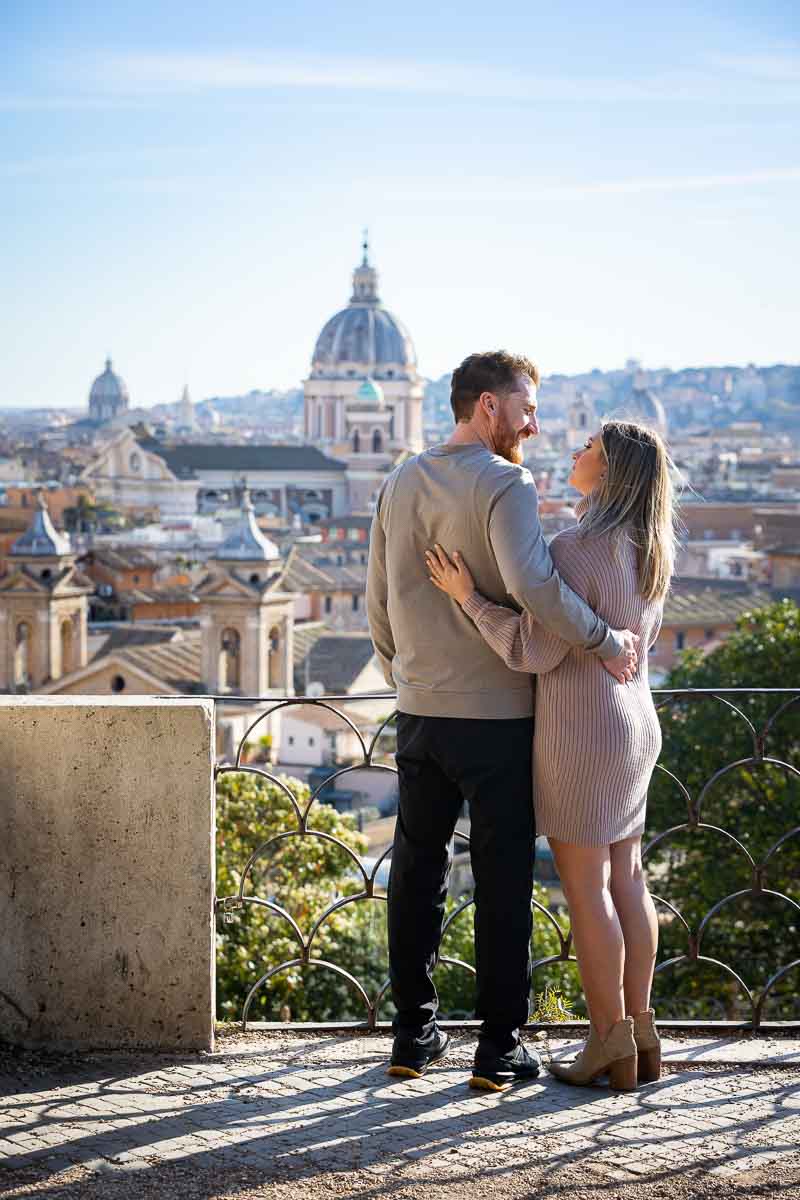 Portrait picture while looking at the roman skyline from the Pincio park terrace outlook 