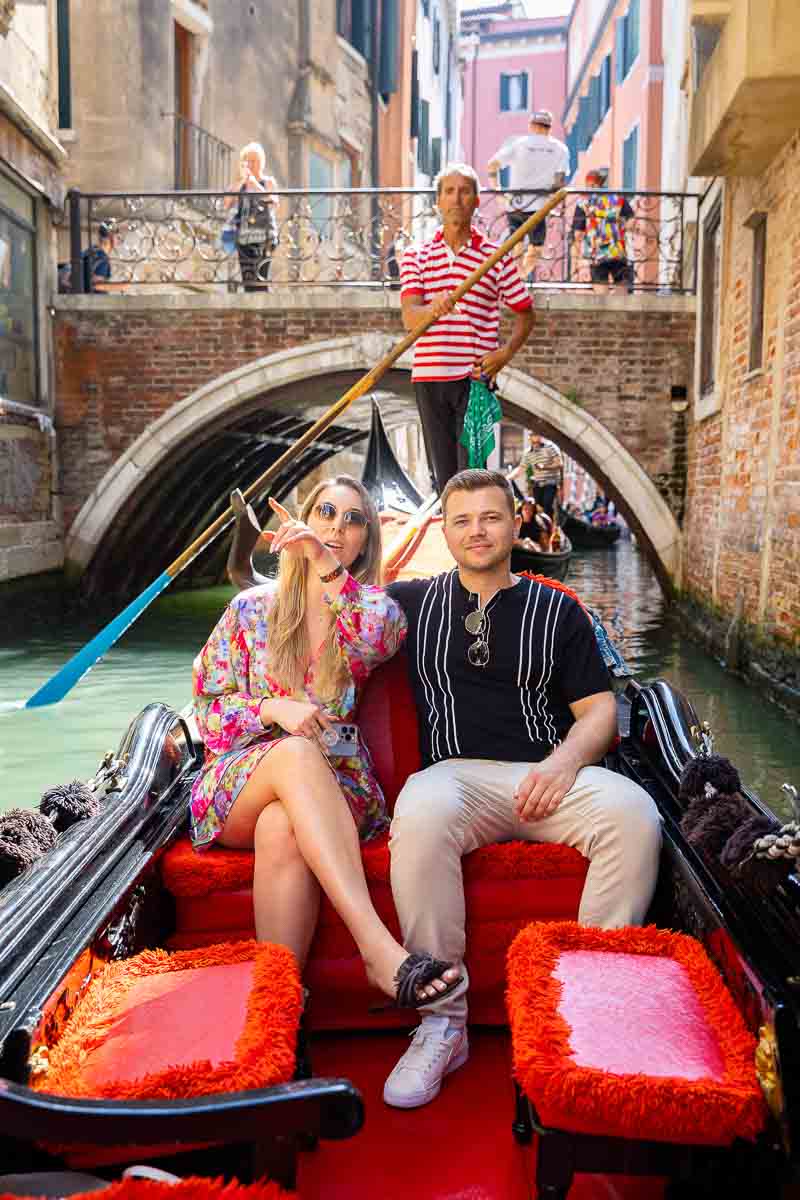 Couple enjoying a nice boat ride through the small water canals 