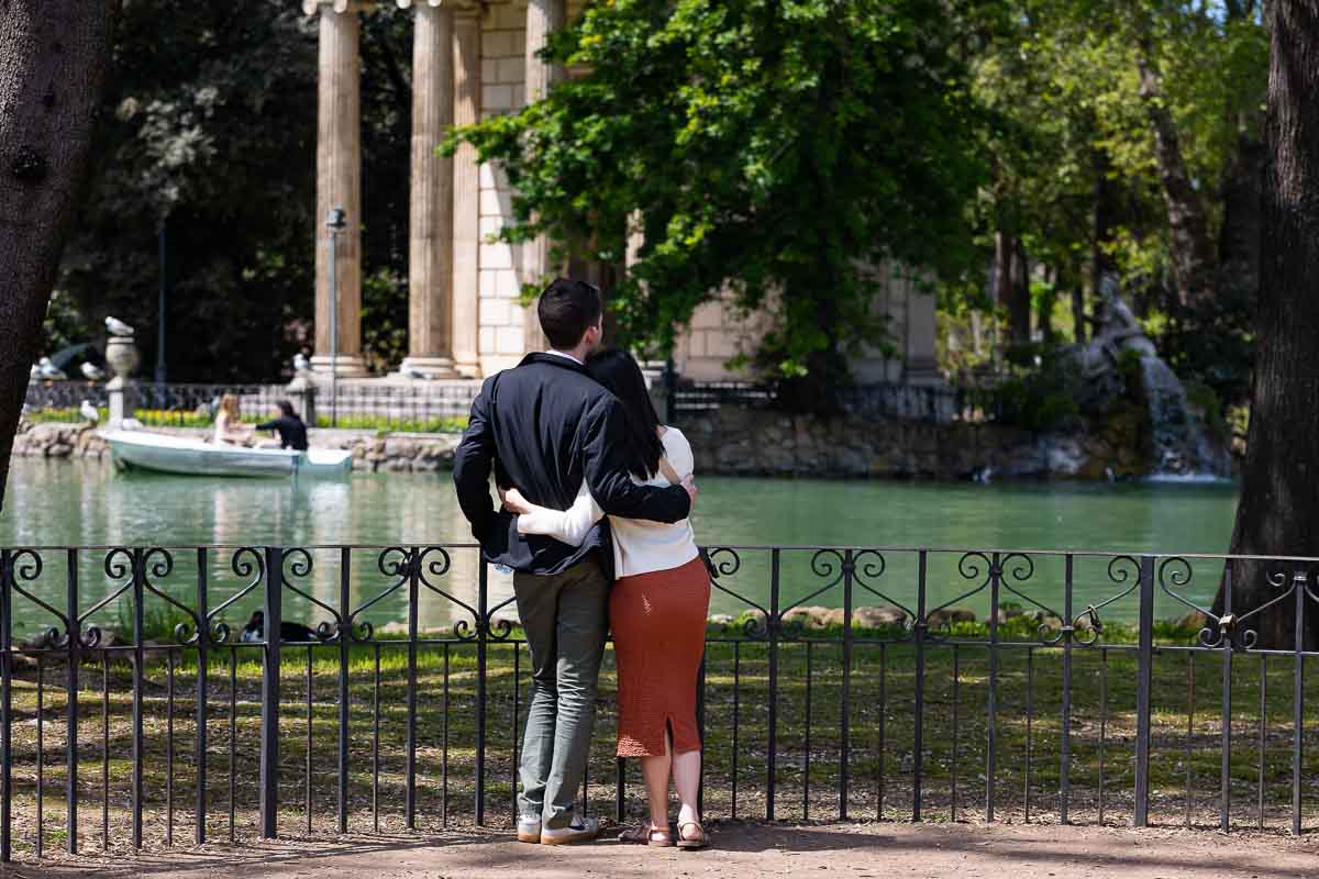 Couple admiring the view of the temple from the other side lake