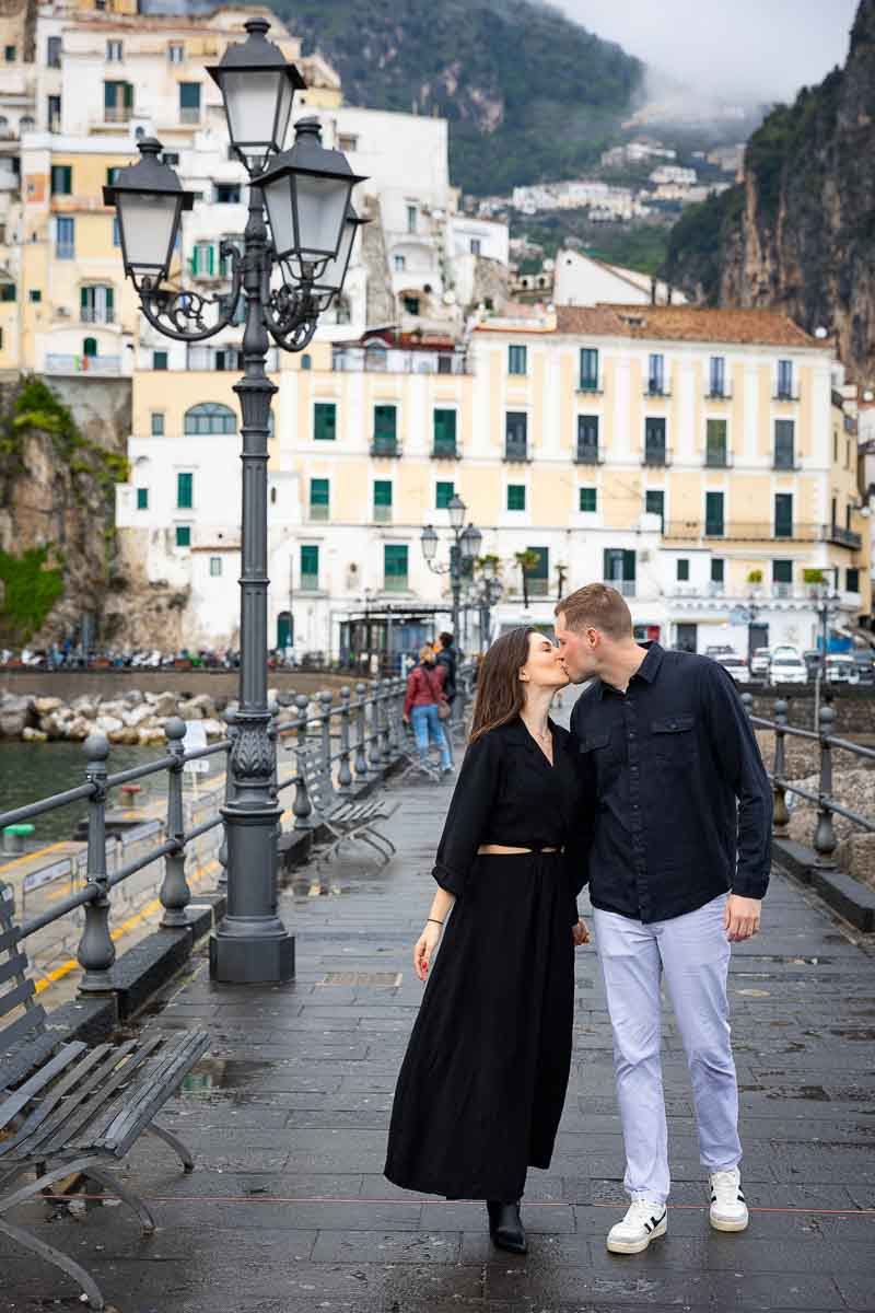 Kissing by pier engagement photography