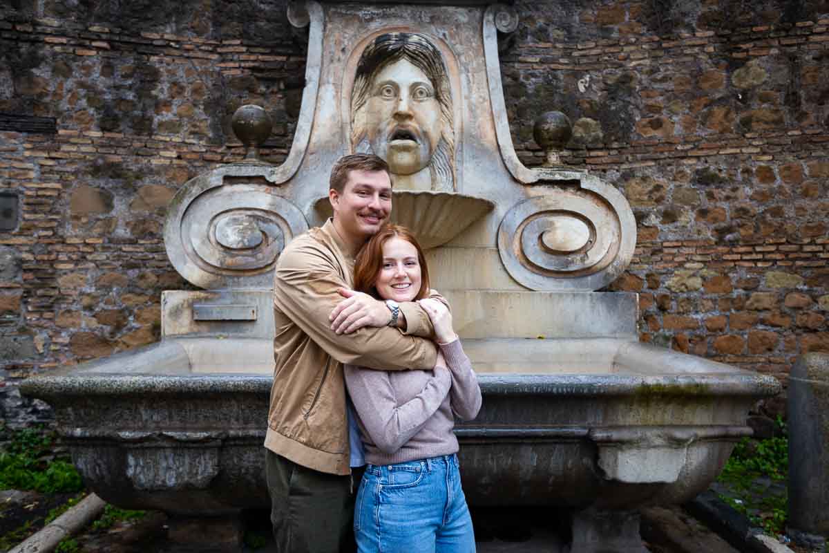 Couple portrait in front of Fontana del Mascherone found in Rome's Via Giulia
