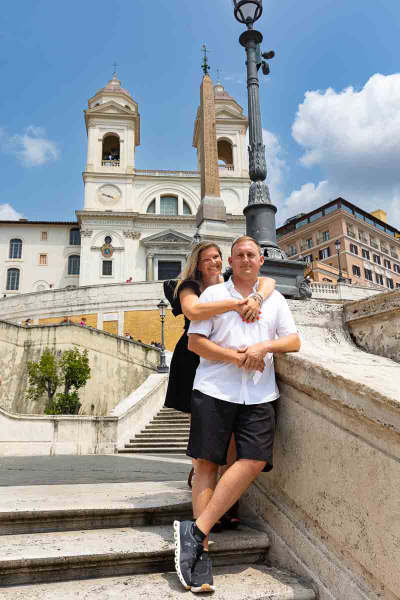 Couple posing for engagement photography at the Spanish steps . Rome, Italy