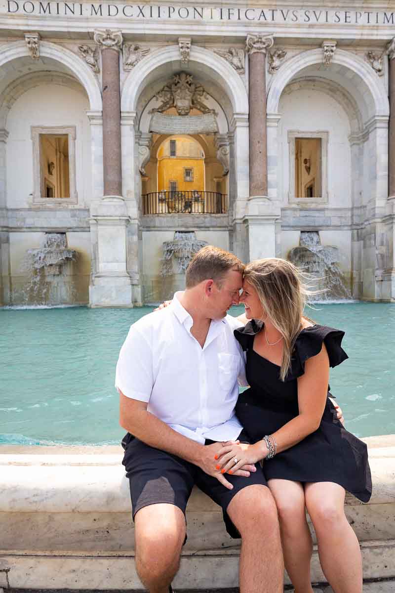 Janiculum hill. Couple taking picture in front of the Acqua Paola water fountain in Rome