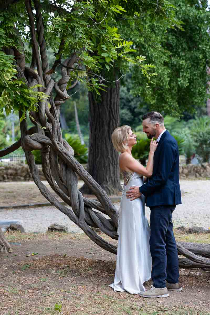 couple portrait taken by an entangled tree in the roman city