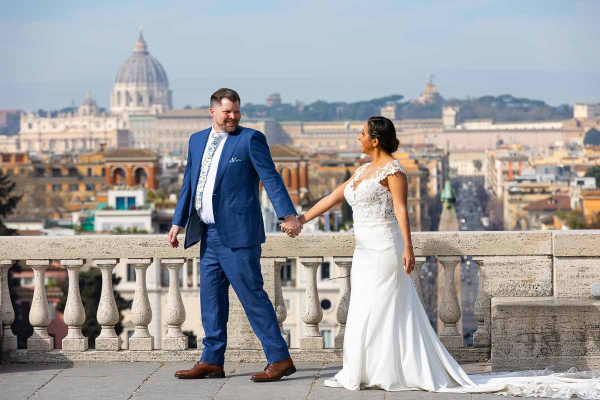 Just married and taking a walk during their photographer session overlooking the city from the Pincio park terrace 