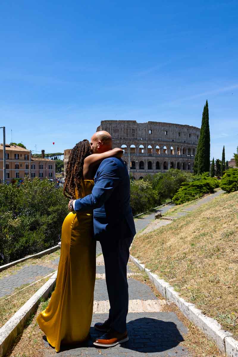 The she said yes moment with bright blue sky over the Coliseum