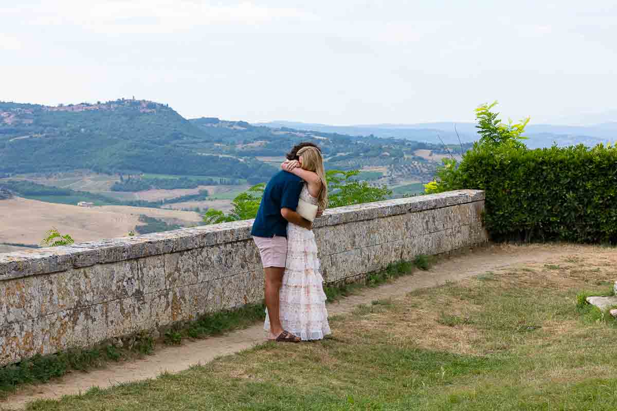 The moment in which the answer was a joyful yes. Couple embracing during a proposed to photoshoot in Italy