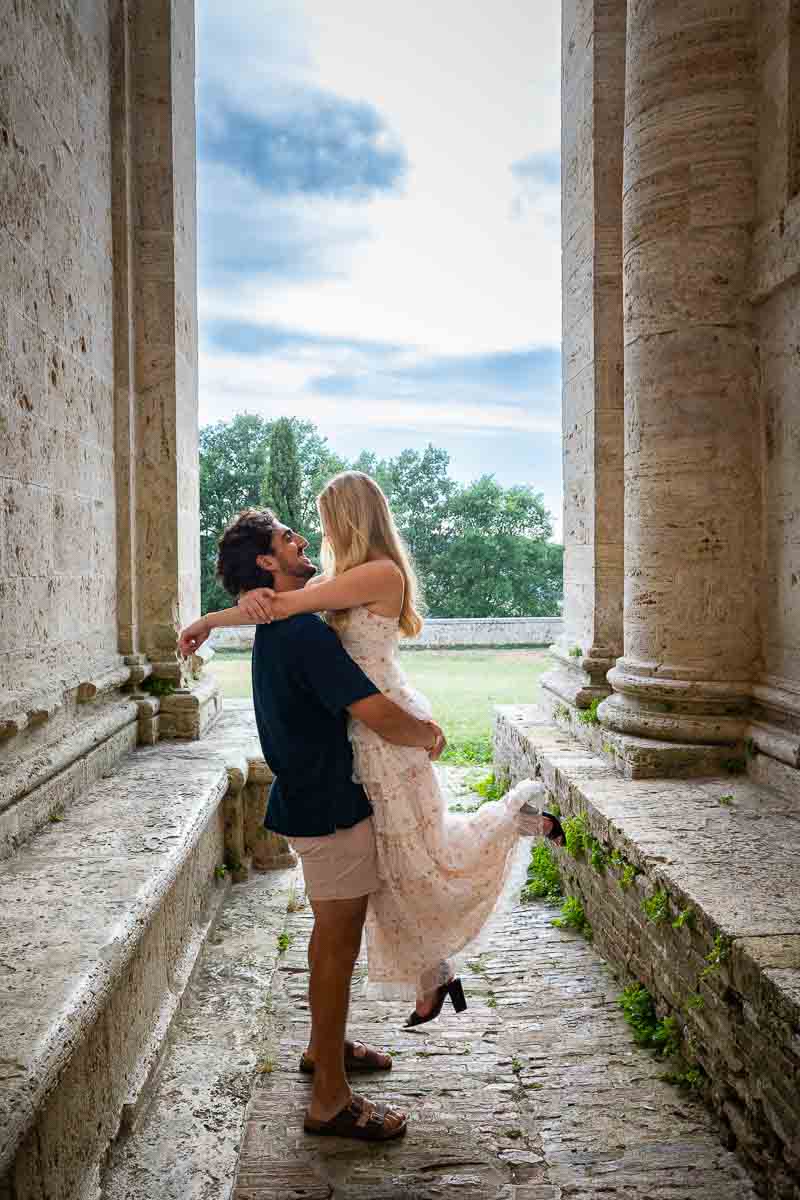Picking up his fiancee to take engagement pictures in between the columns. Temple of Saint Biagio (Montepulciano) Italy