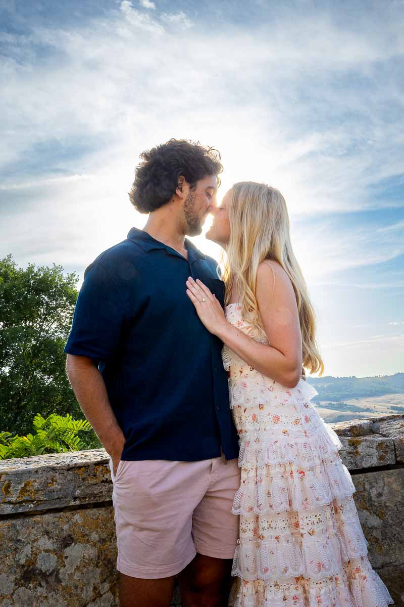 Kissing at sunset in front of the sky