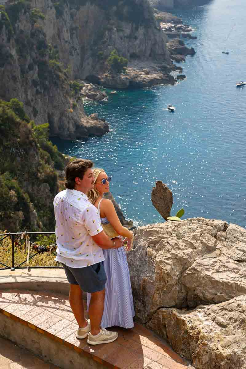 Just engaged couple looking at the Mediterranean sea 