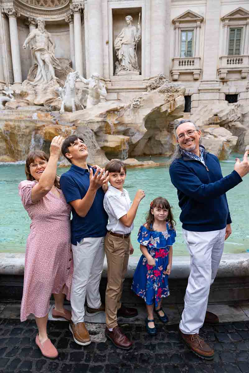 Throwing the coin into the fountain during a photography session 