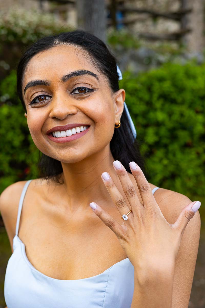 Just engaged showing the beautiful engagement ring. Portrait close up