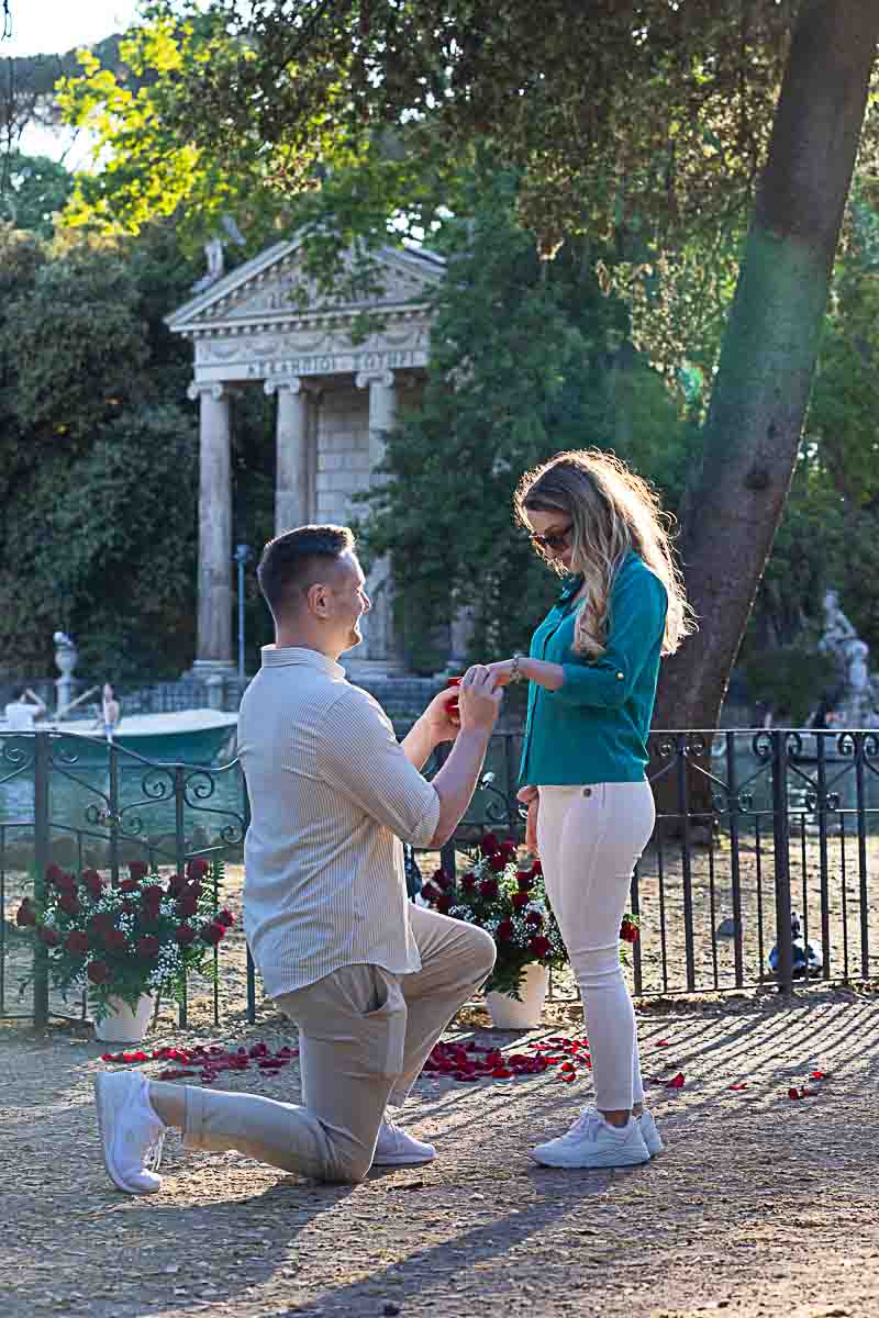 Sunset Proposal in Rome knee down marriage proposing at the Villa Borghese lake