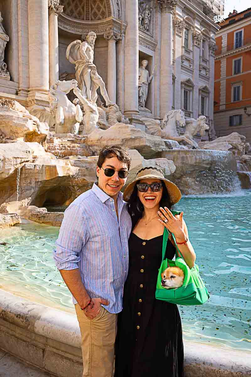 Posed together by the Trevi fountain during an exclusive engagement photography session