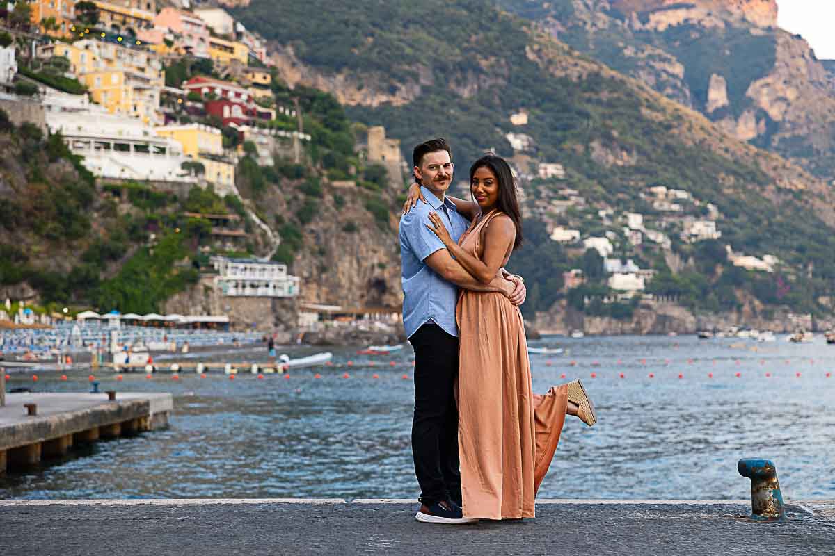 Couple photoshoot by Marina grande and marina piccola in Positano Italy after a proposal in grande spiaggia