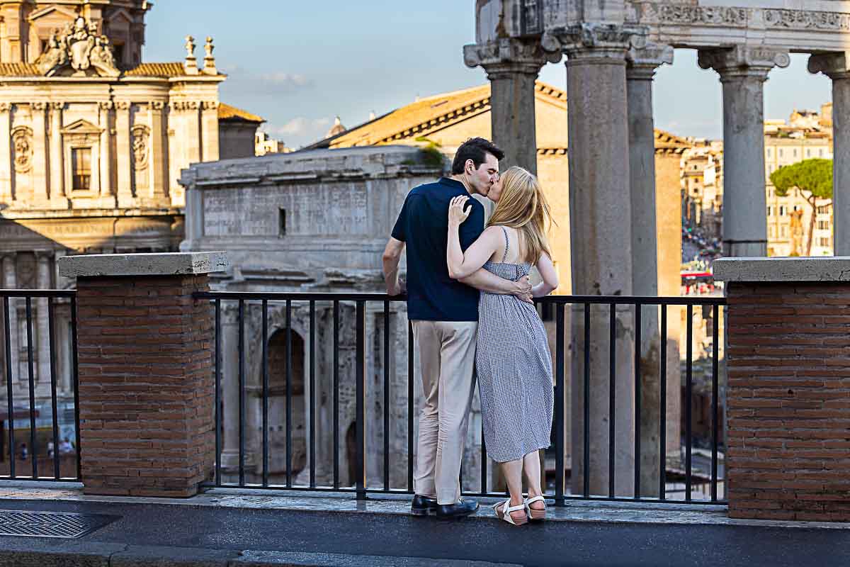 Kissing by the ancient ruins before roman temples and ancient columns