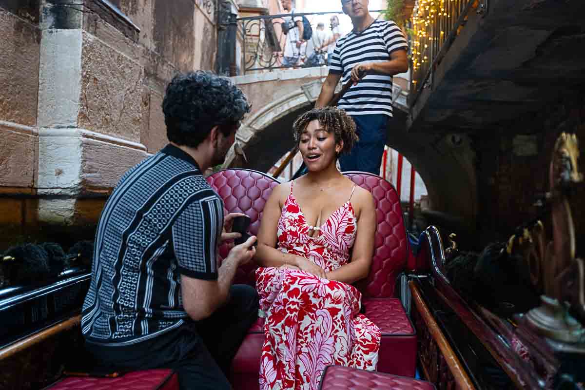 Surprised by the asking to be married on a gondola ride though the venetian canals 