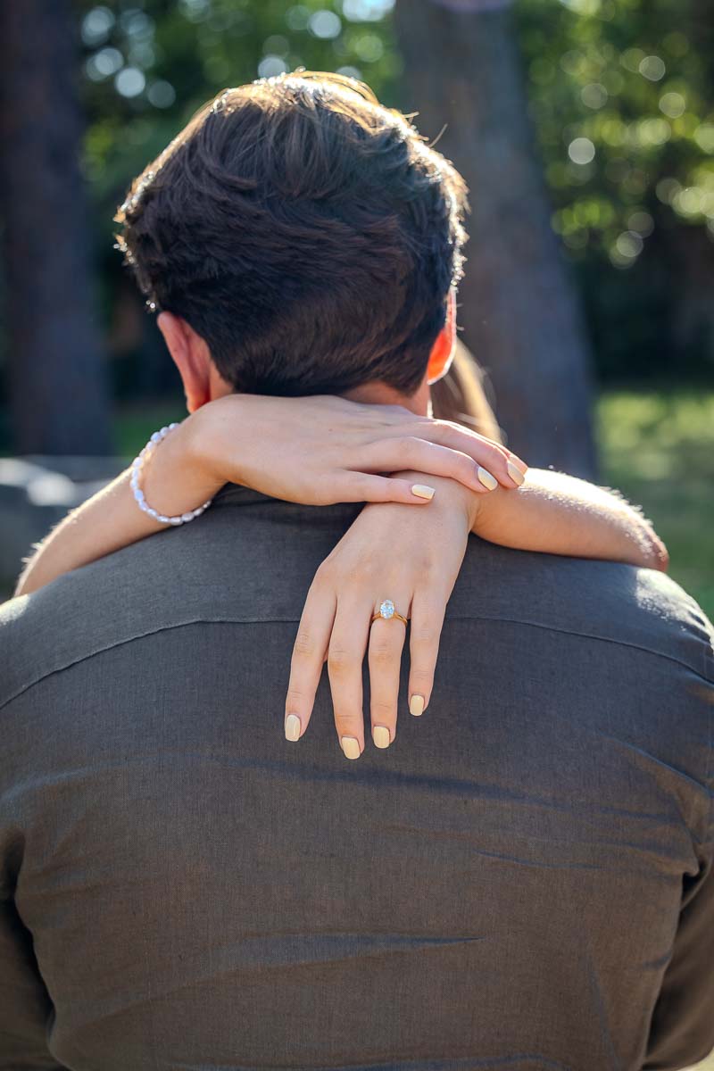 Image close up of her hand with the diamond ring gave as an engagement ring 