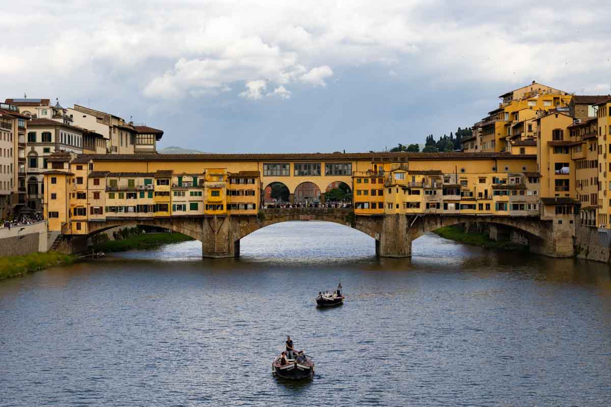 View of bridge ponte vecchio seen from the adjacent one over the arno river 