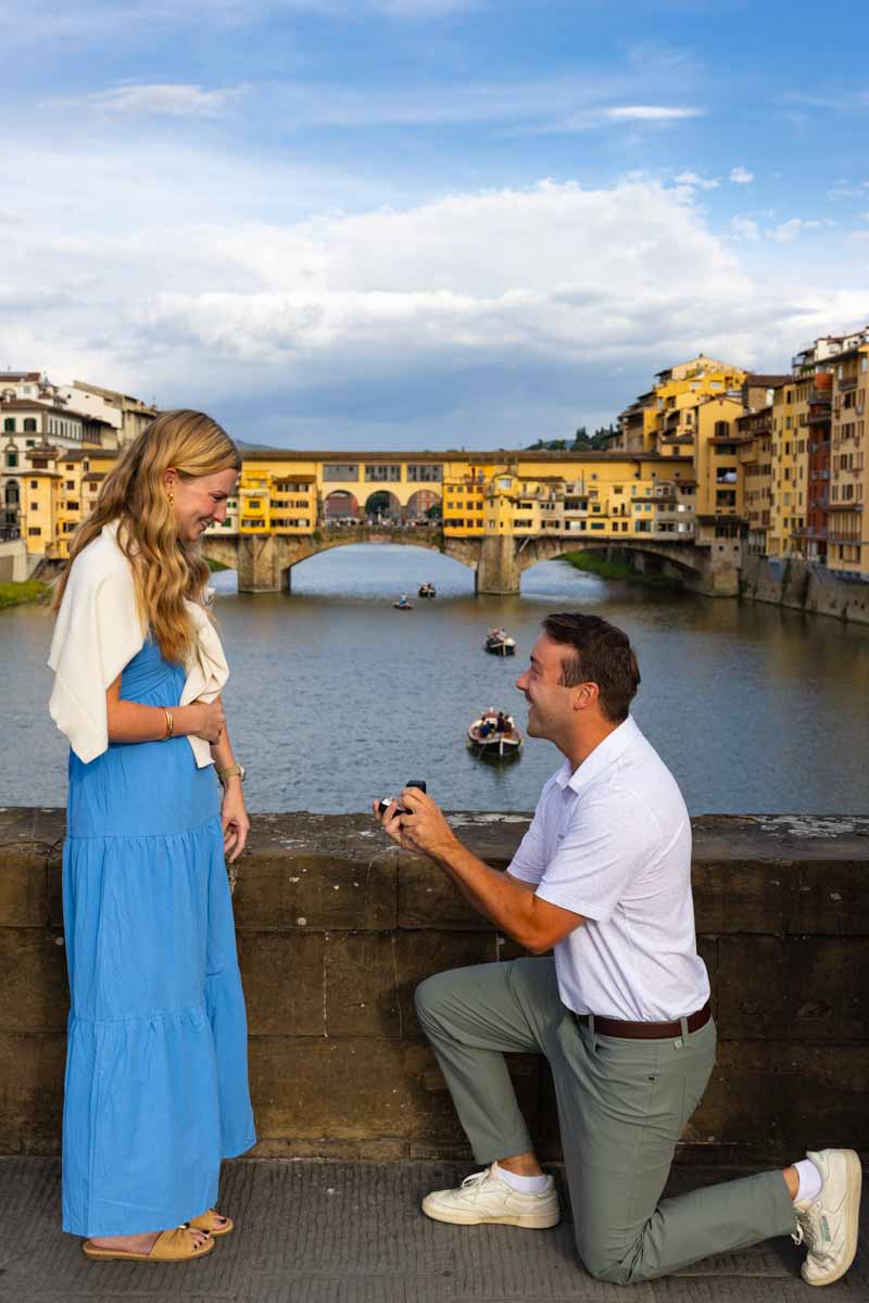 This is the proposal shot where he kneeled down to propose to her on one knee with a photographer from Florence taking pictures 