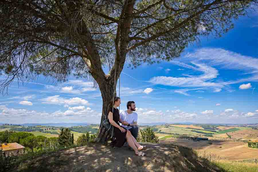 Taking cover from the midday sun under a tree that provides shadows as well as nice photographic conditions 