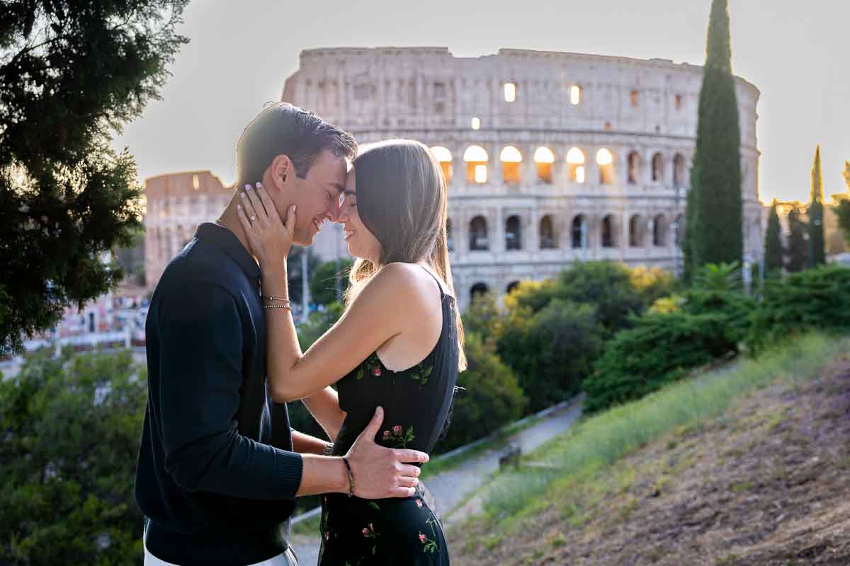 Head to head facing one another by the Colosseum at sunset during the beautiful golden hour 