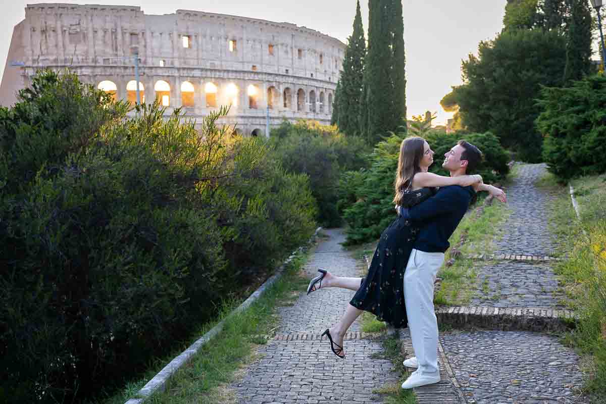 Pick me up pose. Base of the Coliseum photographed by professional photographers expert in taking lifestyle pictures 