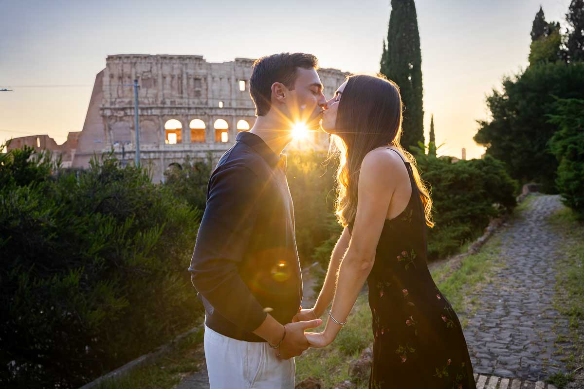 Experiment with sun flares as warm effect during engagement photos in Rome Italy